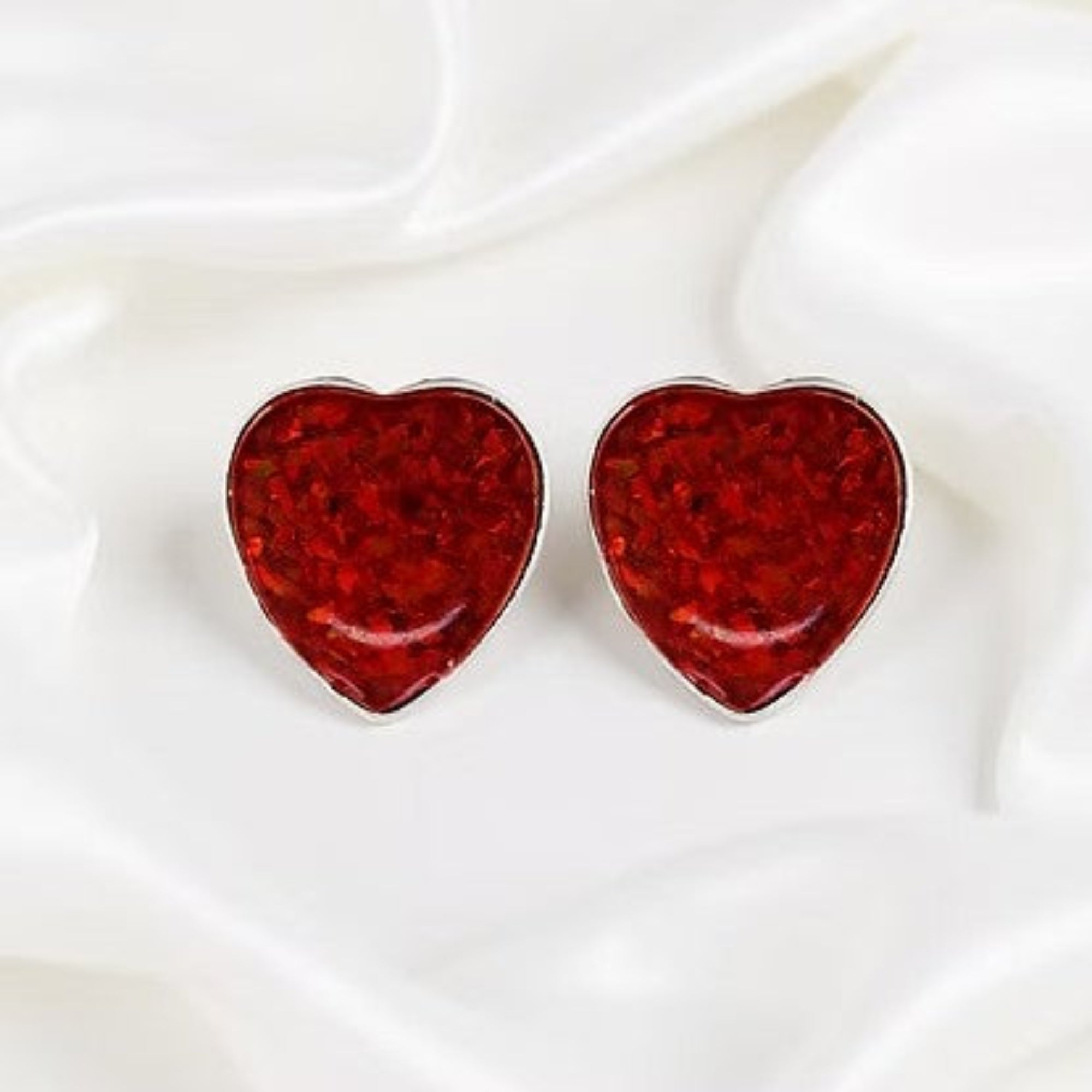 Silver Heart Studded Opal Earrings on Silk White Background