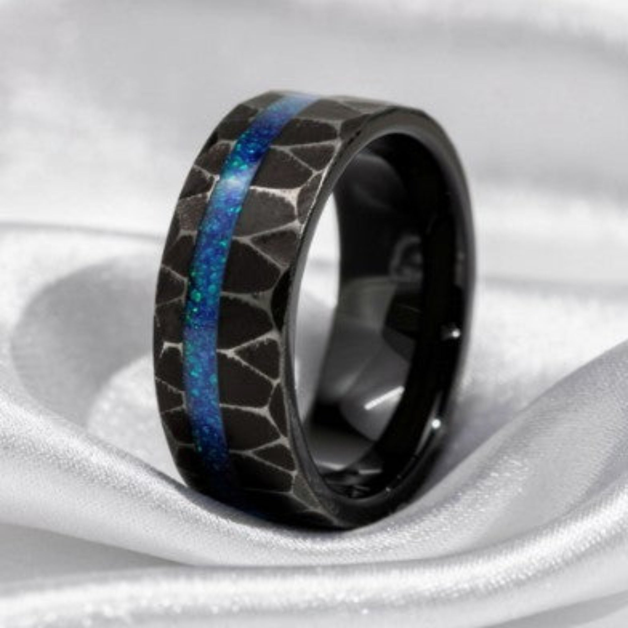 Black-Plated Hammered Tungsten Men's Ring Band On Silk White Background