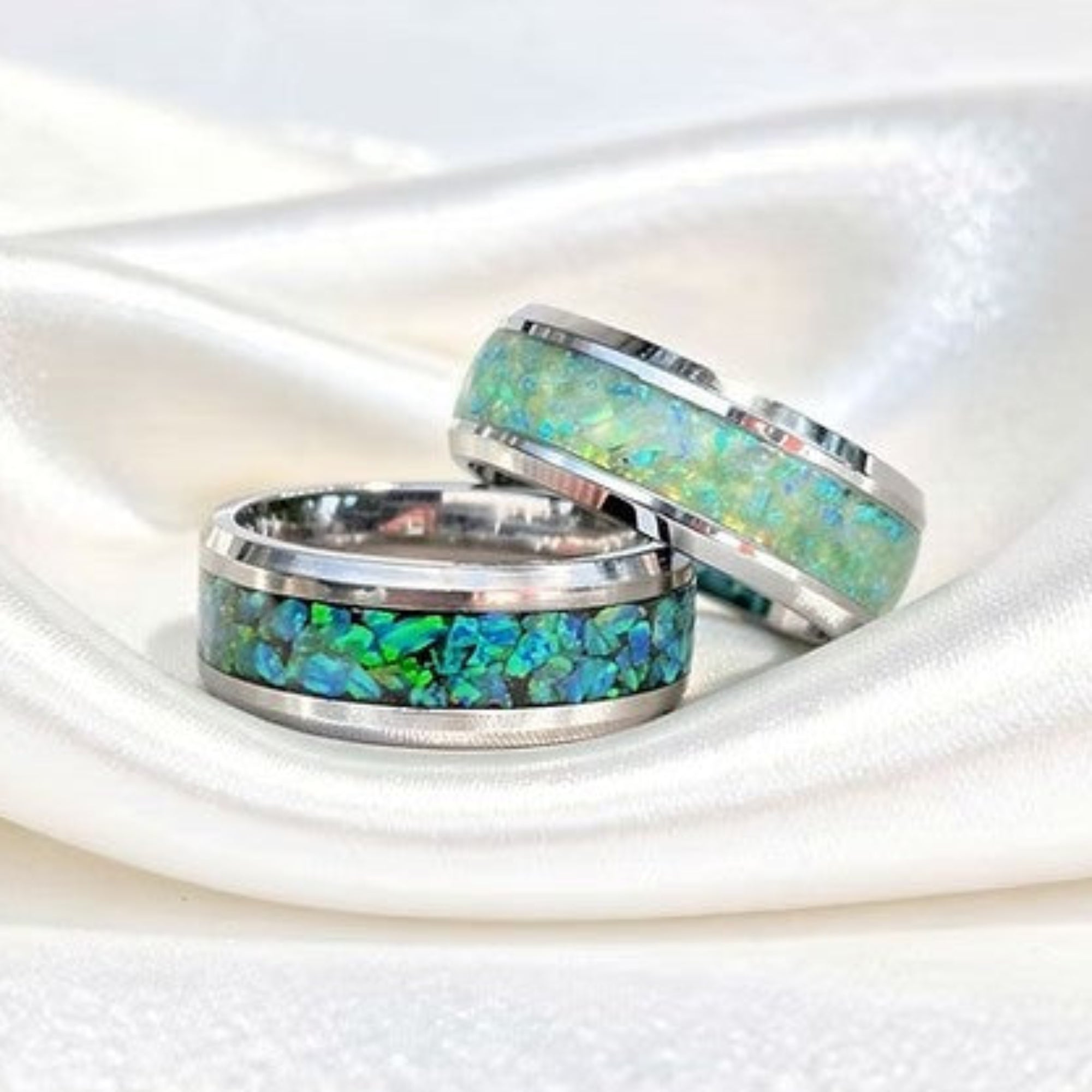 Titanium or Stainless Steel Opal Ring Bands on White Silk Background